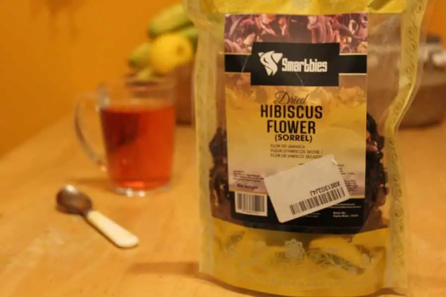 hibiscus tea packet and mug of hibiscus tea