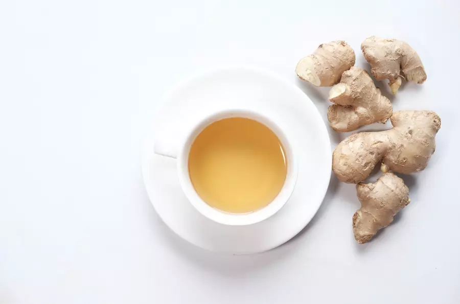 cup of ginger tea with honey